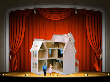 Dollhouse on stage with tiny couple