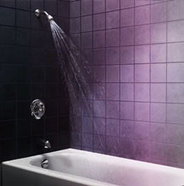 Bath and shower in a purple the shade of a bruise