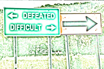 Road sign showing Defeated and Difficult