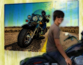Teen on motorcycle against background of motorcycle on road