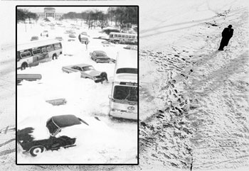 Man walking through snow, with cars stuck in snow