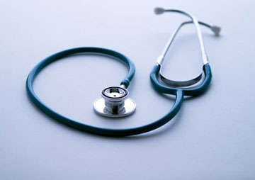 Stethoscope on blue background