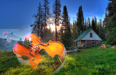 Rustic cabin at sunrise with superimposed violin