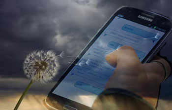 Stormy background with superimposed hand texting on phone
