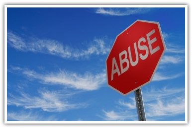 Stop sign with the word 'abuse'