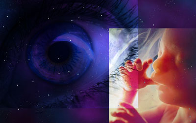 Starry background with superimposed eye and fetus