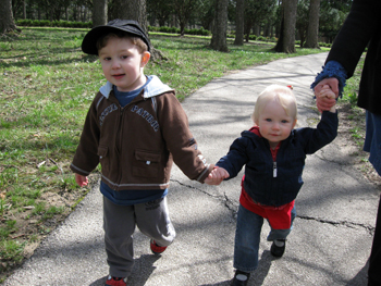 Two children holding hands