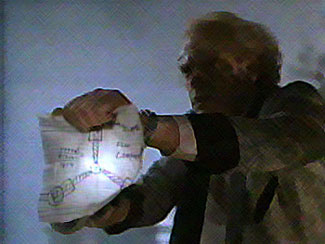 Christopher Lloyd with schematics