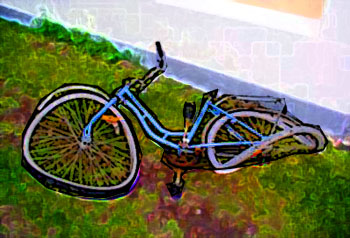 Broken bicycle on the grass