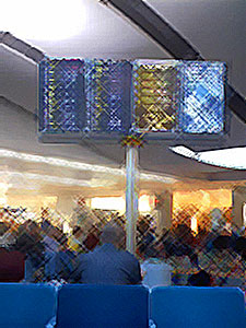 Digital sign in airport lobby, with cross-hatch effect