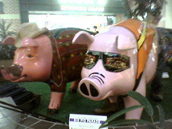 Plastic pigs wearing costumes, shop window in Westminster, Virginia, photo by Alyce Wilson
