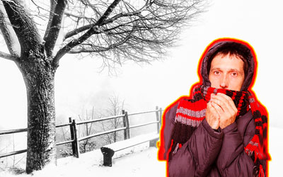 Wintry background with bundled up man with red