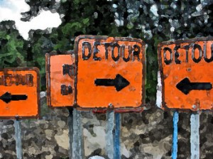 Detour signs point at each other