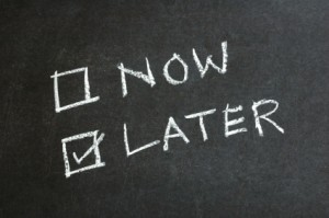 Chalk board with "now" and "later"