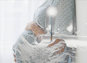 Pregnant woman in hospital scrubs with superimposed winter scene.