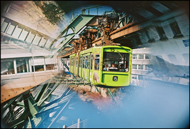 Green subway train with mirror effect.