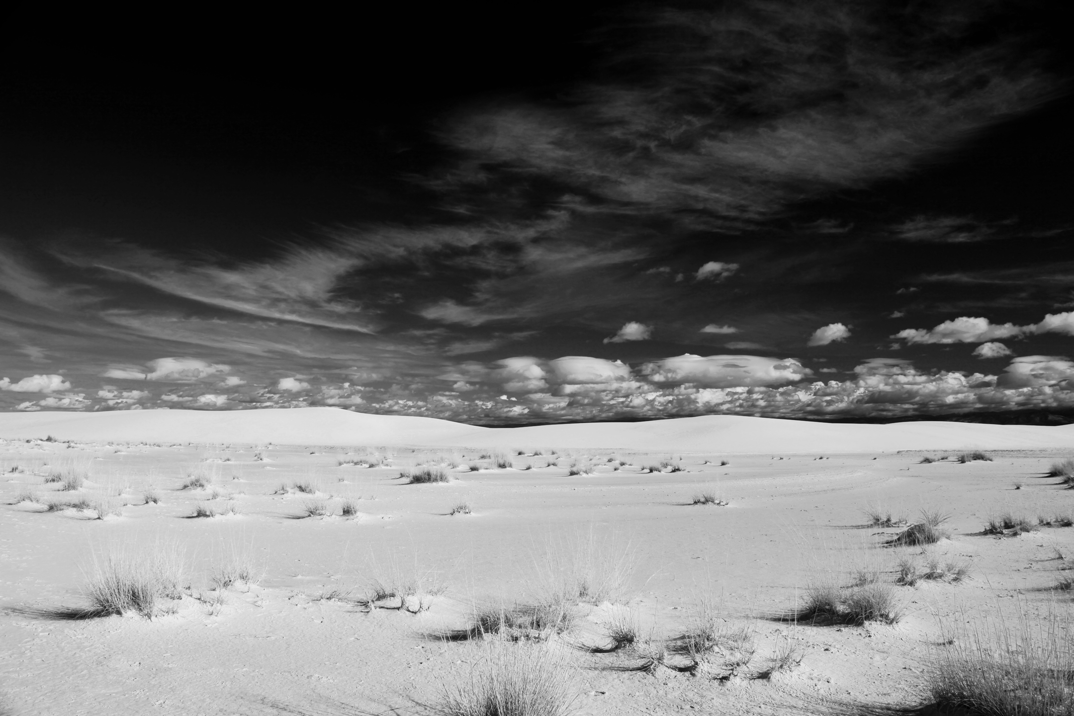 "Distinct" by Fabrice Poussin, desert with dark sky
