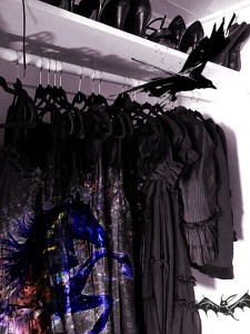 Closet of black clothes with crow, bat, horse