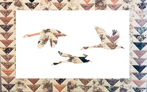 Flying geese quilt with geese silhouettes
