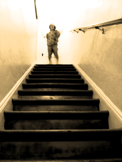 Boy at top of stairs