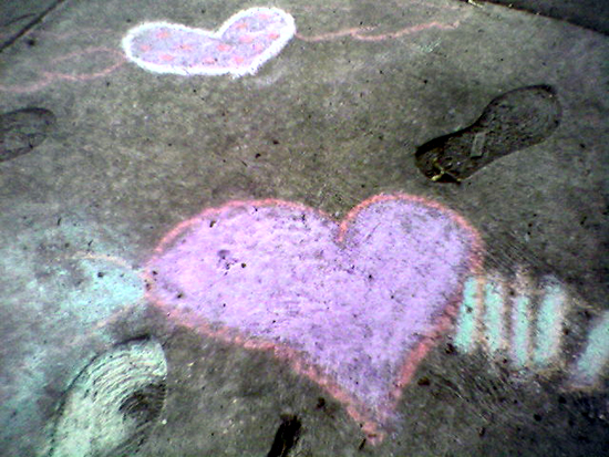 Chalk hearts with cement footprints